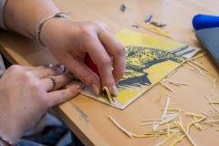 Lino printing cutting blade in use