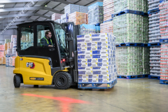 Fork lift truck stacking pallets taken on-location used for press release and marketing purposes