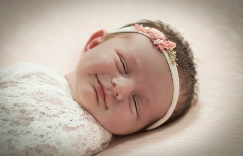 Smiling Newboen baby girl