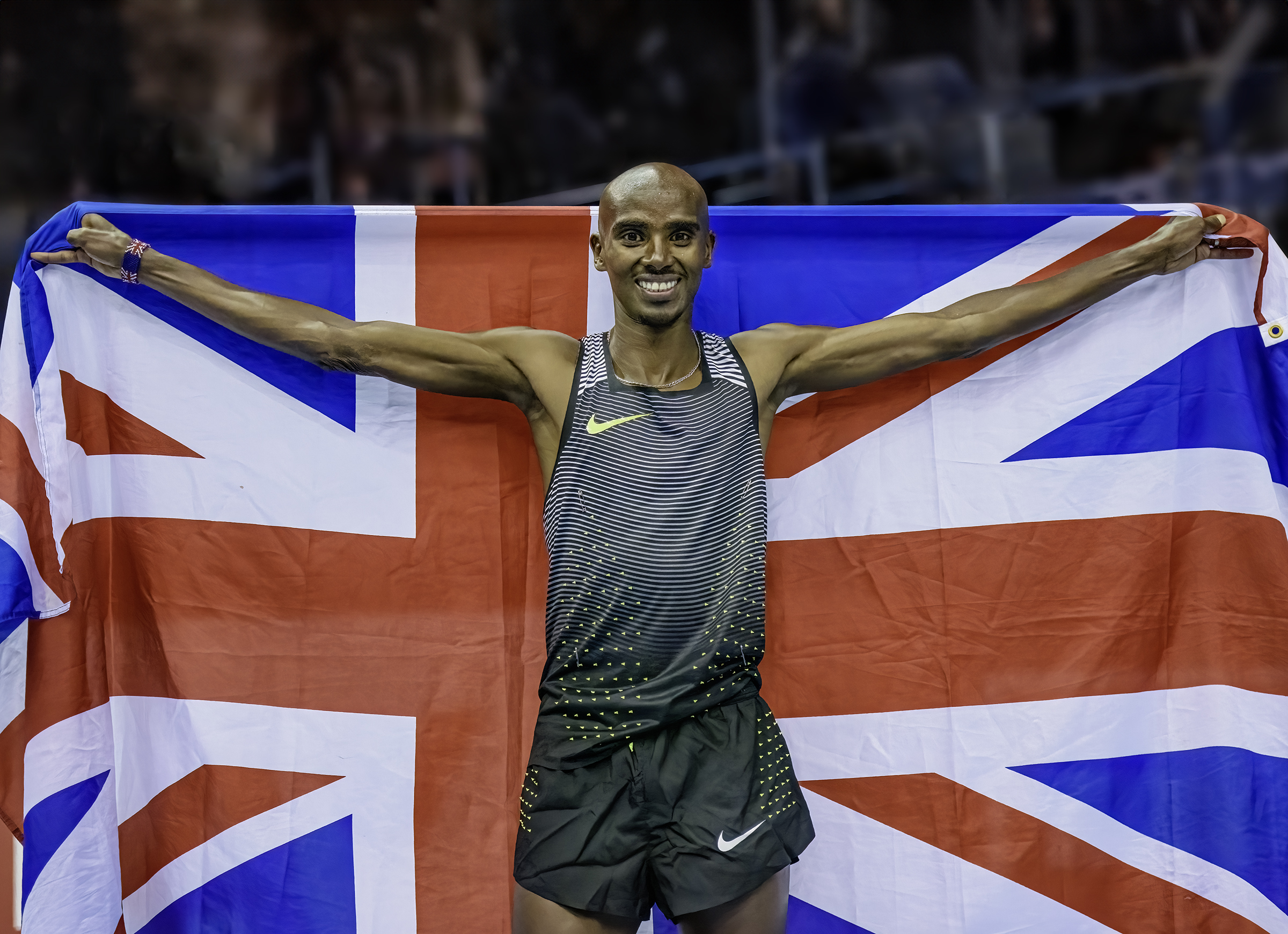 Sir Mo Farah celebrates Victory with the Union Jack flag at Birmingham arena taken by Image and Events Photography in Peterborough