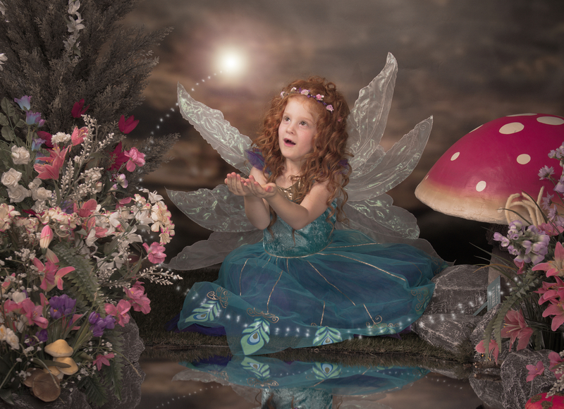 Fairy photograph of little girl in blue dress from the studio of image and ivents photography in Peterborough, Cambridgeshire