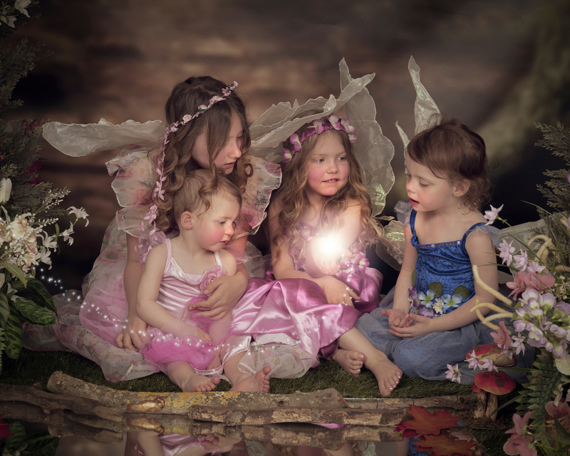 Family of little fairies look on in amazement taken in the enchanted forest studio set of Image and events Photography, Peterborough
