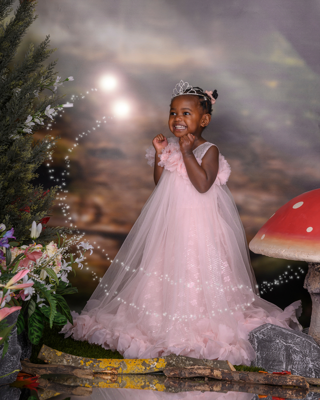 Little excited fairy in pink dress taken in the fairy and elf, enchanted forest set at image and events photography in Peterborough, Cambridgeshire
