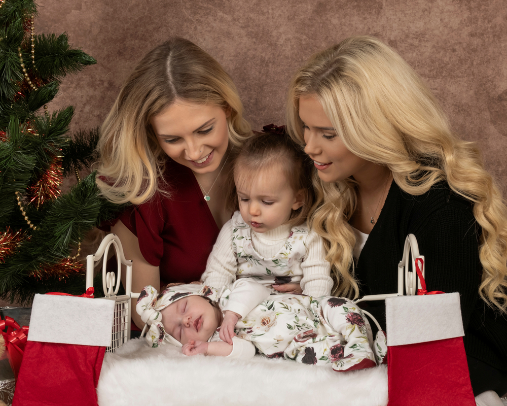 Family group image with young sibling taken at the studios of image and events photography in Peterborough, Cambridgeshire